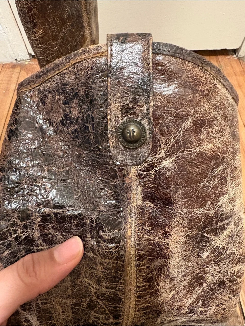 Frye brown leather knee-high boots with distressed texture